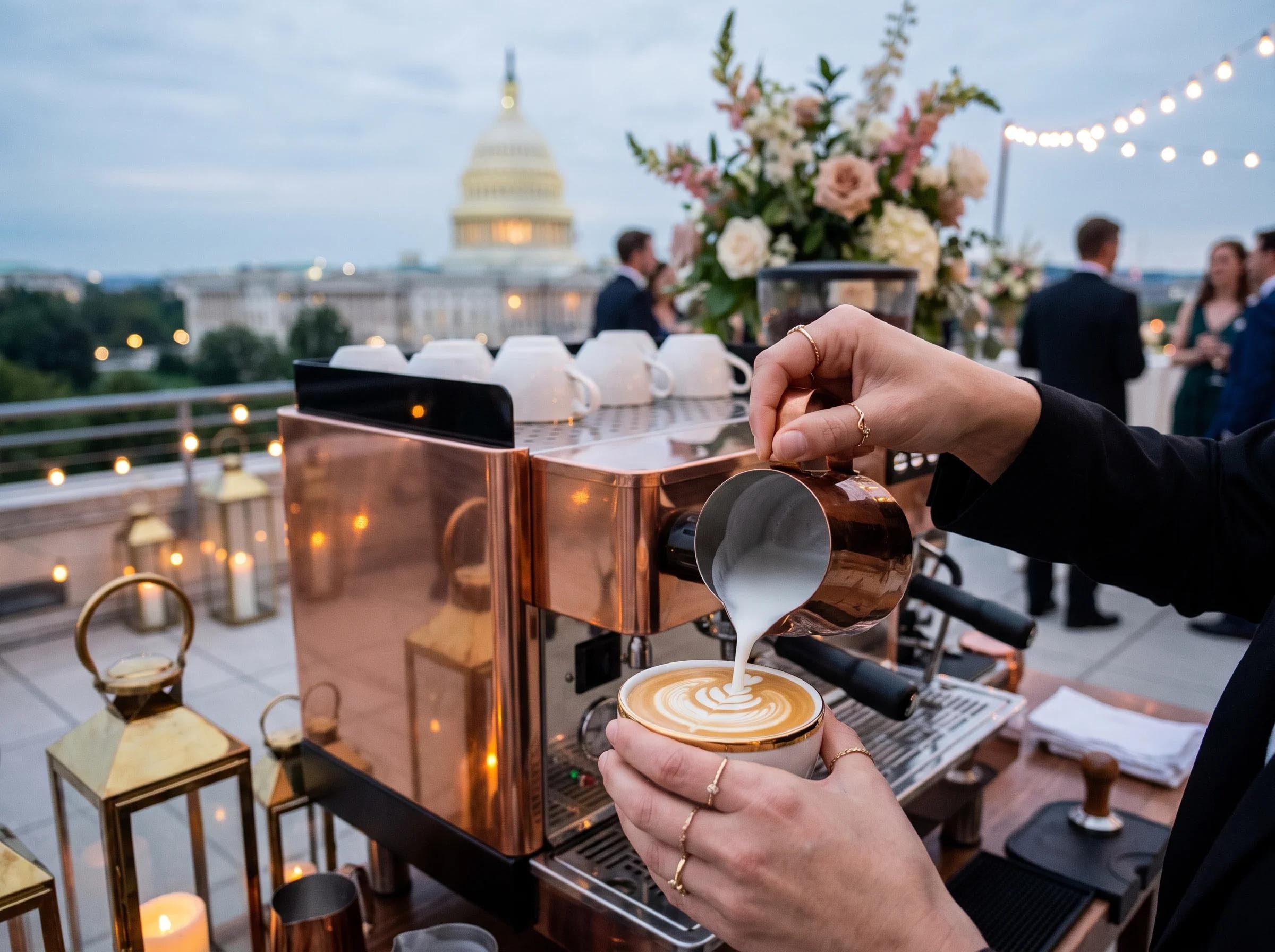 Close-up of a barista's hands pouring latte art at a luxury Washington DC rooftop wedding reception, White House dome faintly visible in blurred background, copper and gold styling